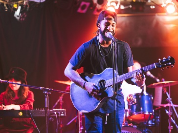 A band playing on a stage.