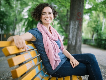 A person sitting on a public bench.