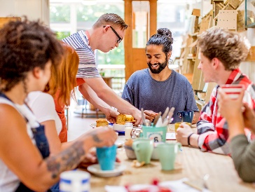 A group of people meeting in a café.