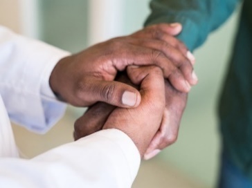 2 people shaking hands.