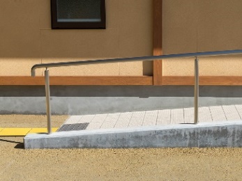 A ramp with a handrail.