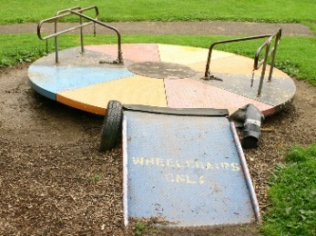 A playground with an accessible ramp onto the equipment.