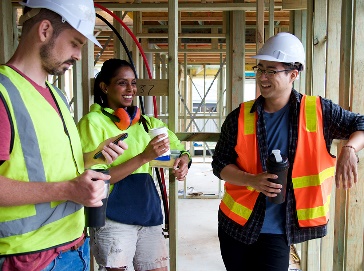 A group of construction workers on a building site.