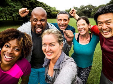 A group of people taking a photo together in a park.