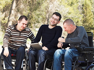 A group of people having a conversation together in a public space.