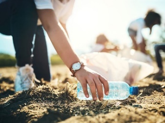 A person cleaning up rubbish in a public space.